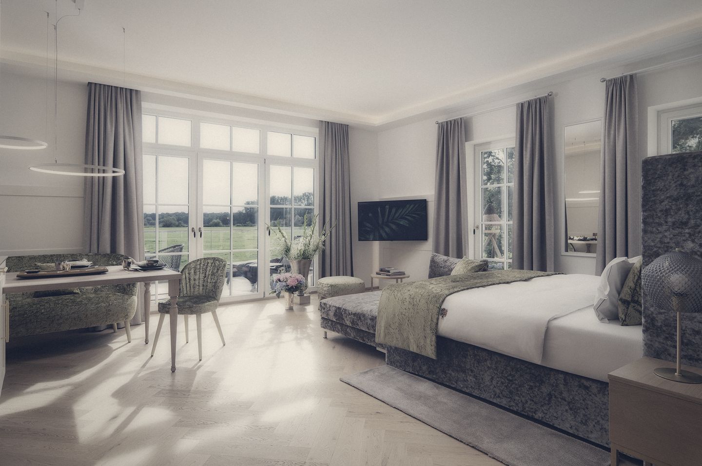 Helle Suite mit Samtbett und Blick über die Wiesen